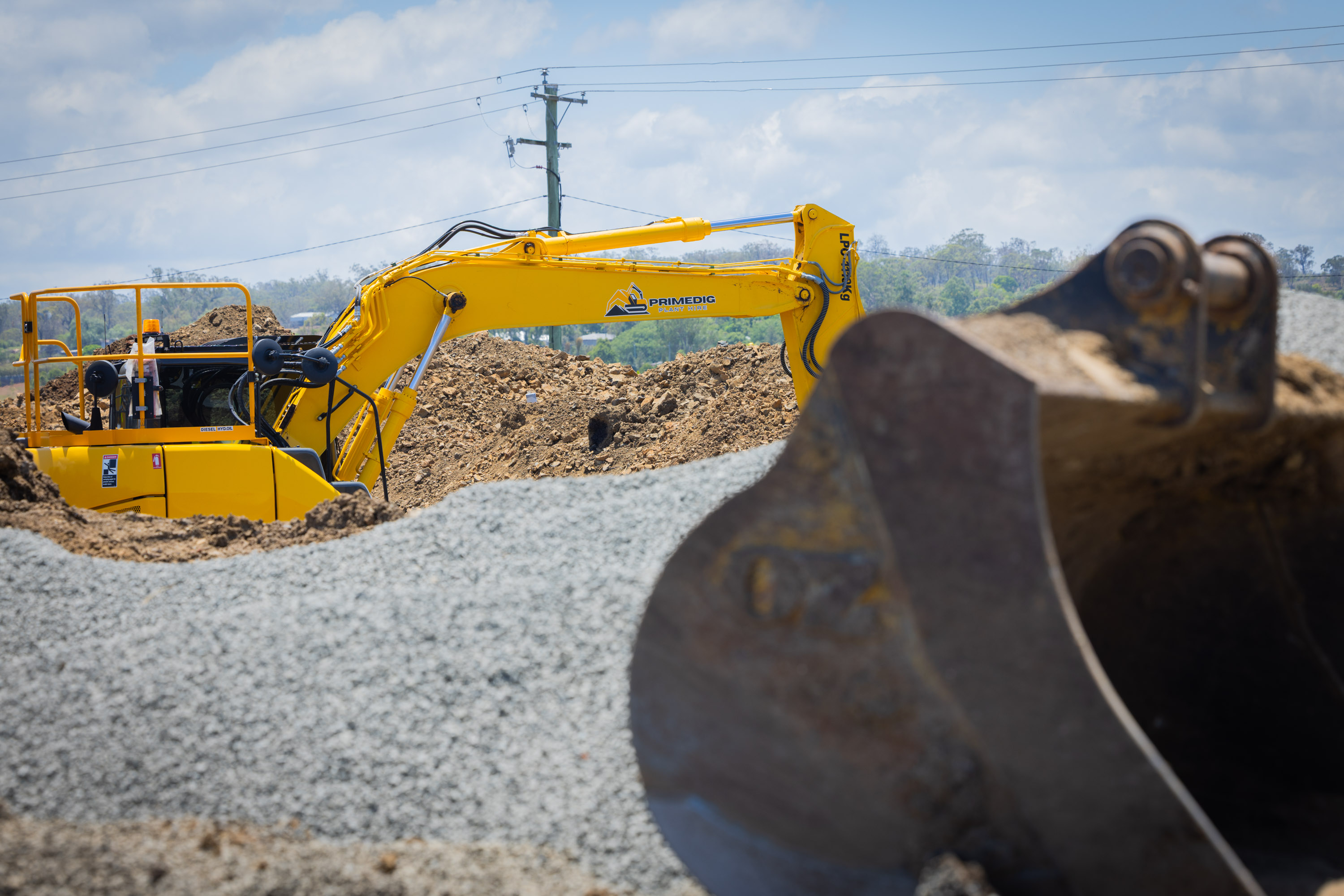 Sumitomo excavator moving gravel on a civil earthworks site